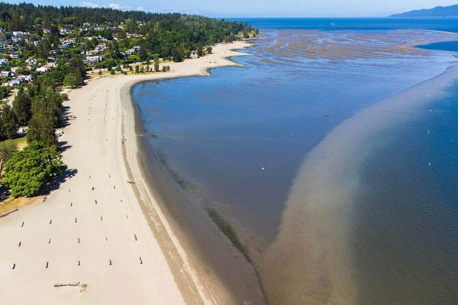 Explore Vancouver: Beaches & Downtown Audio Tour Bundle - Spanish Banks to UBC: wide beach space, big waves, and a university story