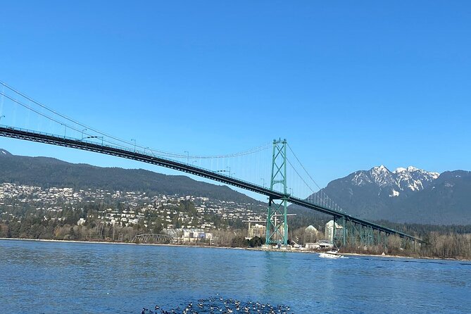 Private Guided Grand City Tour in Vancouver with your luggage - Steam Clock, Edgemont Village, and the Olympic torch details