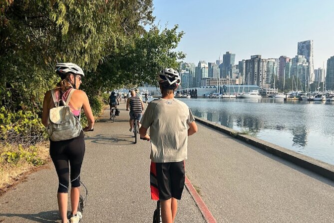 Stanley Park Seawall E-scooter Rental with Self Guided map - Lost Lagoon and Coal Harbour, viewpoints with birds and mountains