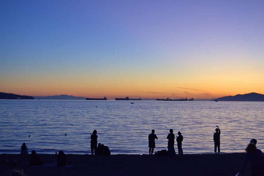 Sunset Bus Tour: Stanley Park & English Bay Photostops - English Bay at Night: A Beach Stop That Feels Like Vancouver